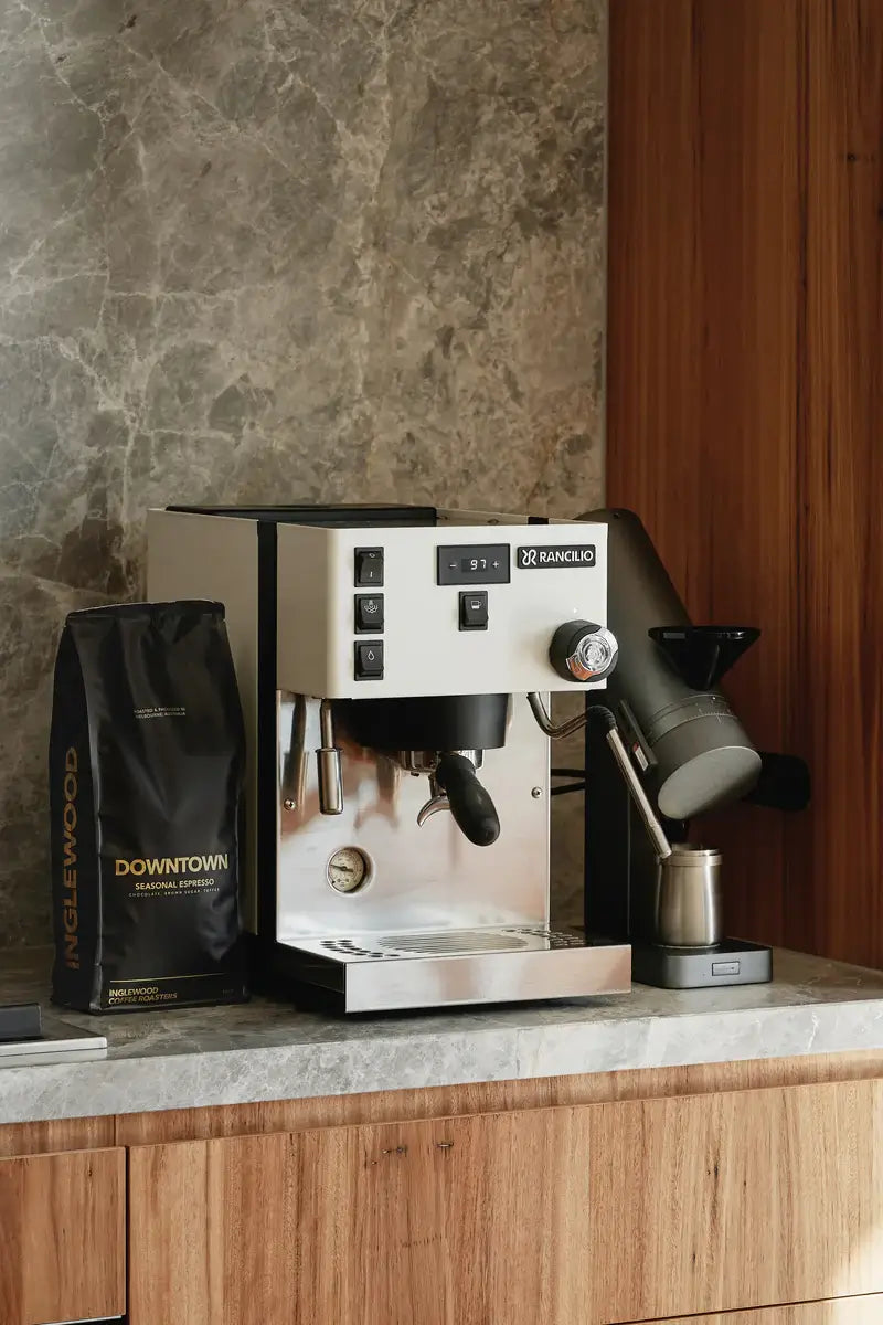 Inglewood coffee bag placed next to an espresso machine
