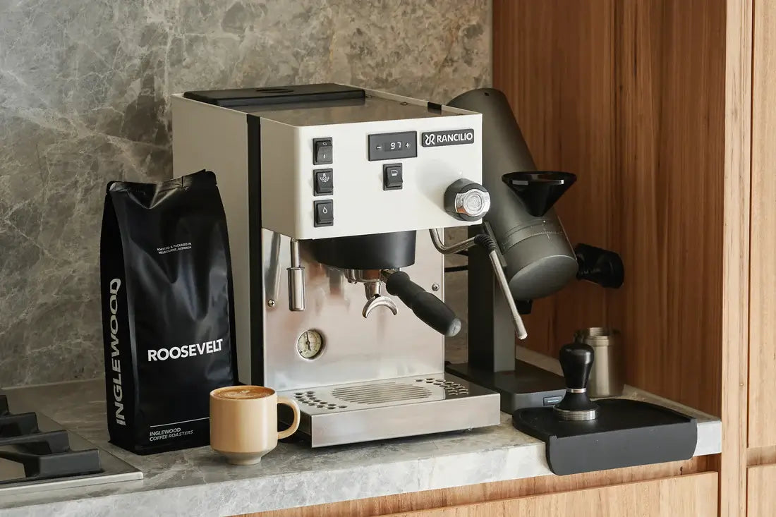 Inglewood coffee bag placed next to an espresso machine